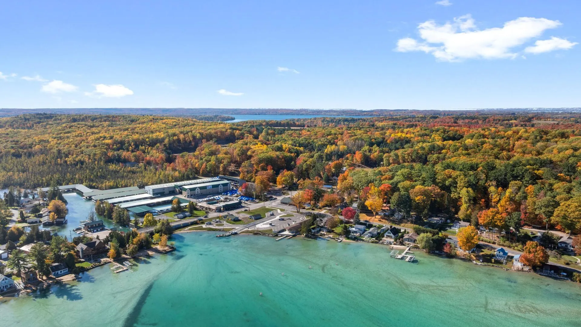 Aerial of Torch Lake's turquoise water